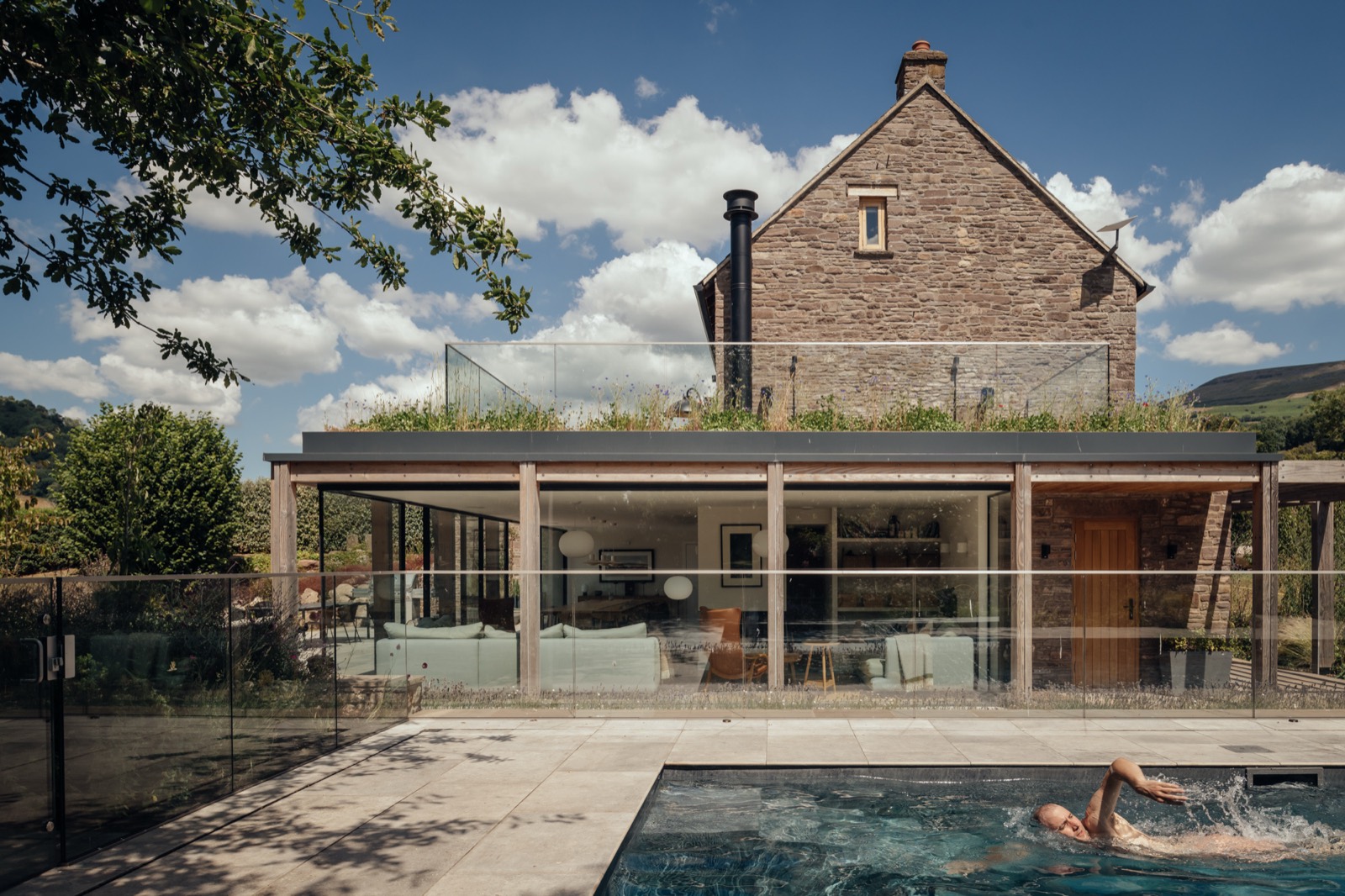 The house above the green roofed extension