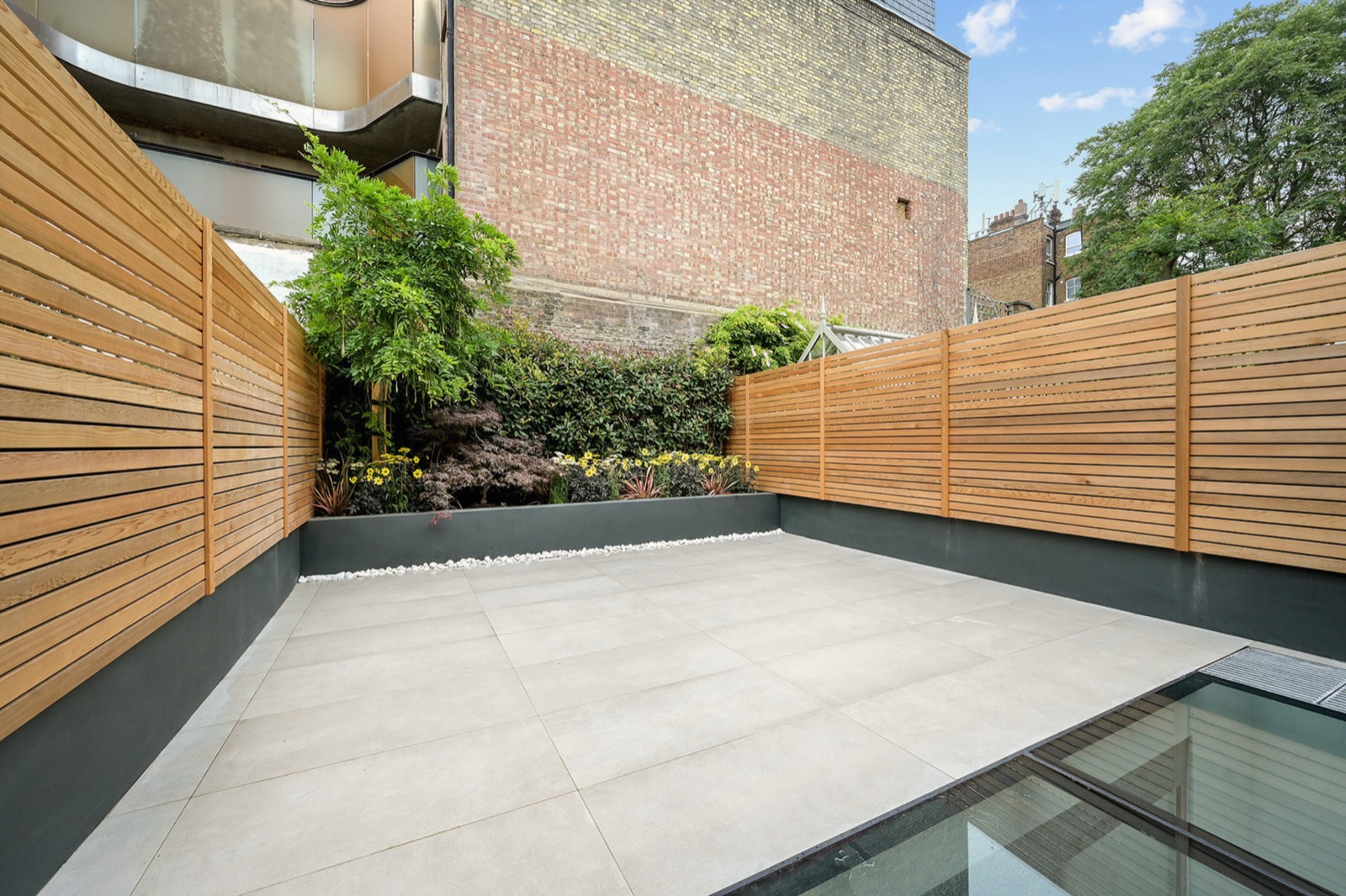 The rear terrace, with walk-on glass over the lightwell below