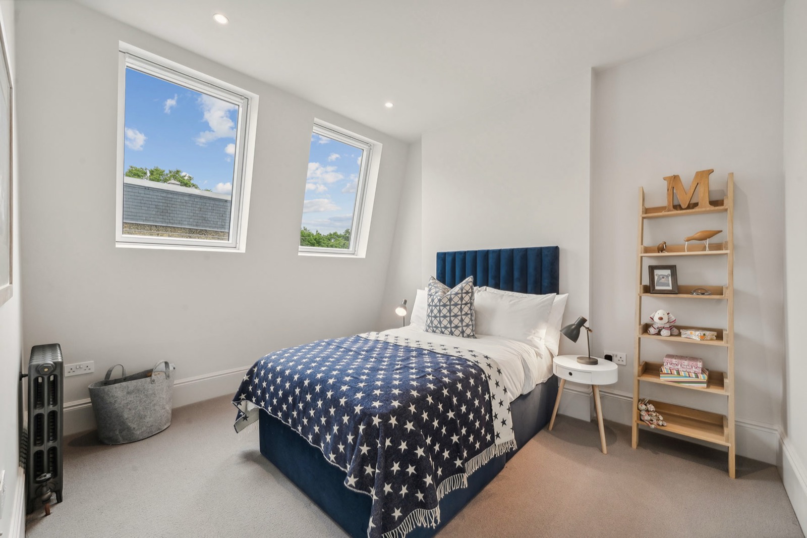 A bedroom in the roof with two rooflights