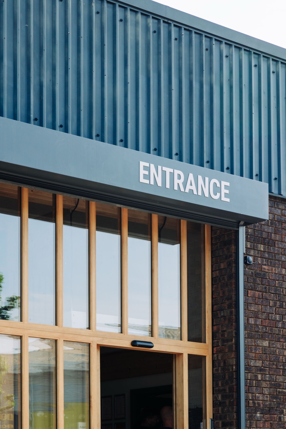 The entrance doors between timber fins