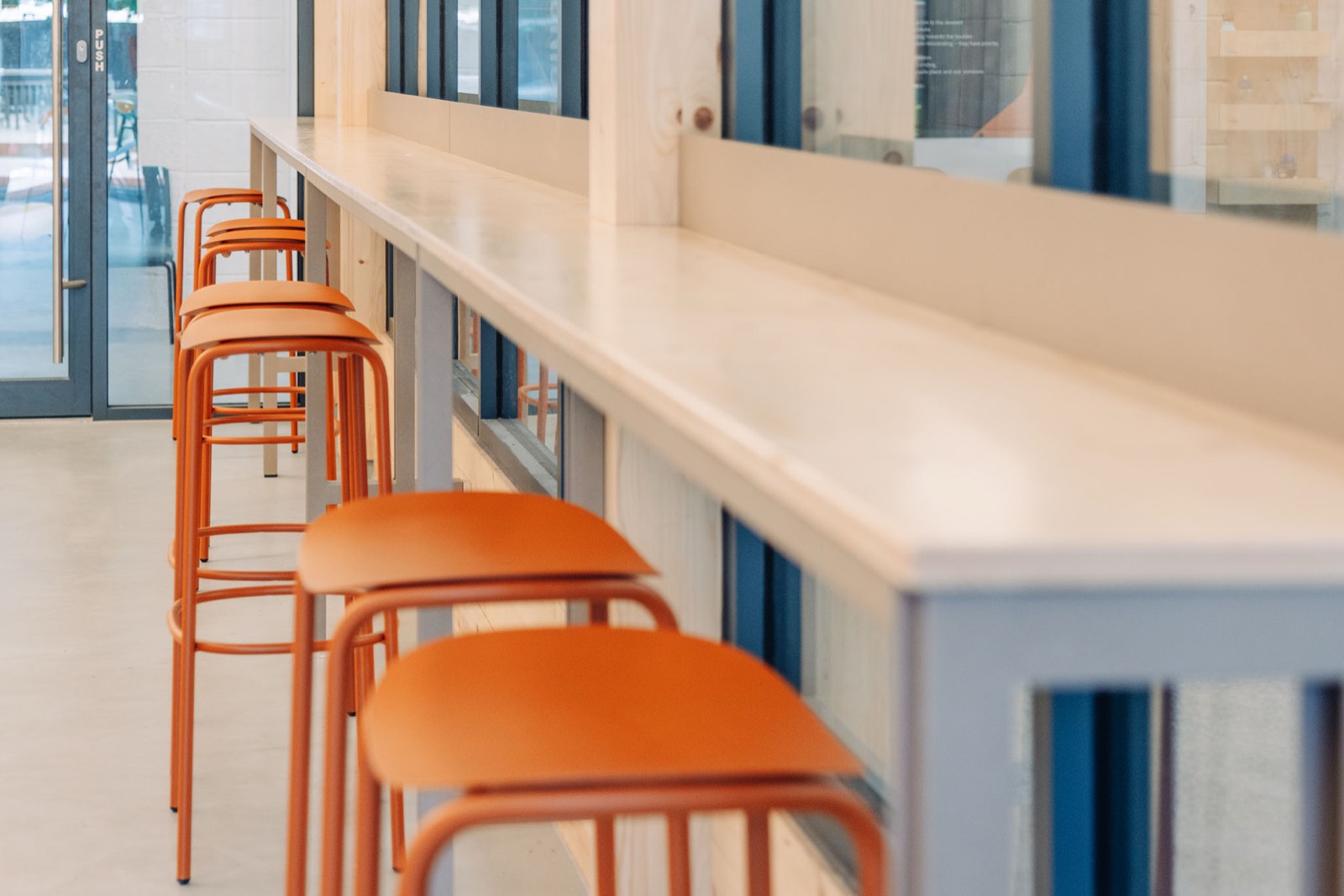 The window bar with its orange stools